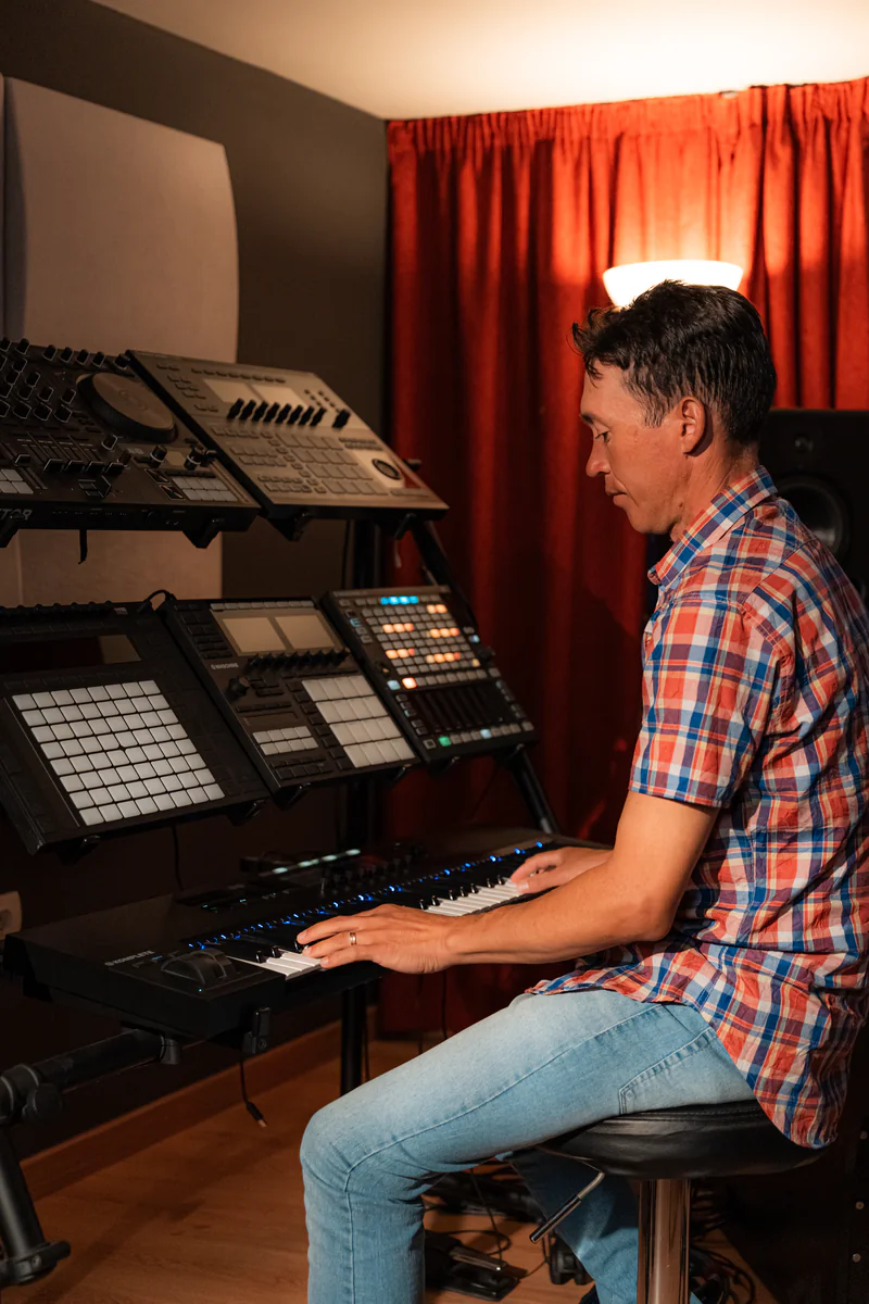 Zirano composing at the piano in his studio