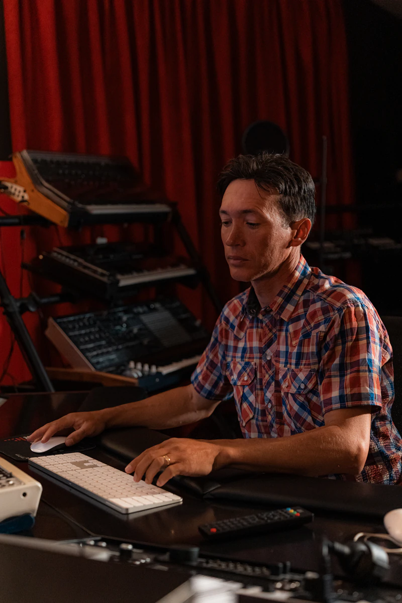 Zirano producing music in his studio